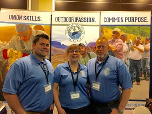 (L-R) USA staff Craig Coffin, Heather Tazelaar and Kevin Grubbs prepare to greet union members at USA’s booth at the 2016 BCTD Conference.