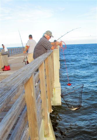 A special “lift net” is valuable in raising large fish from the water surface to a pier.