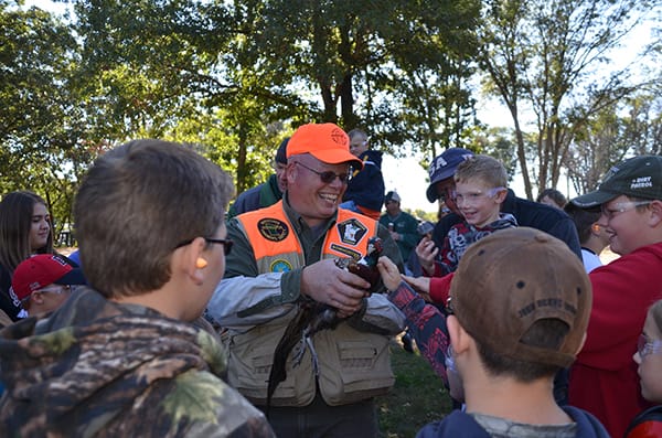Mike Ganz, Vice President and Business Representative of Bricklayers Local 1 gives kids the chance to get up close and personal with pheasants as a part of his live upland bird dog demo.