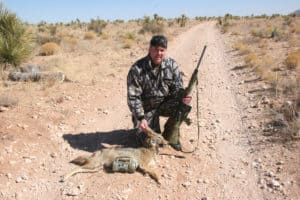 Predator hunter Jeff Scurry with a New Mexico coyote. 