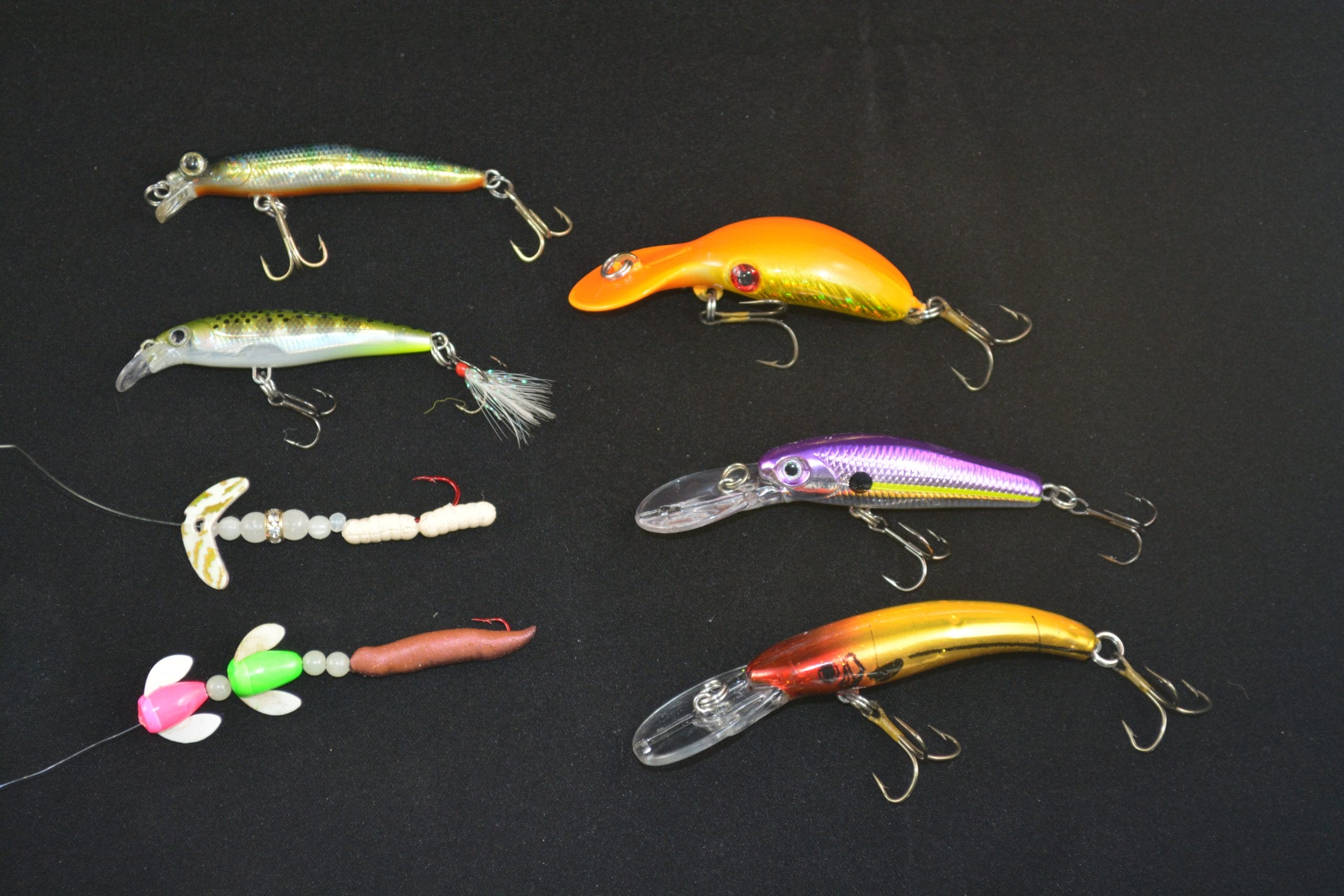 A wide variety of lures work when trolling for panfish. Clockwise from bottom left: Two Worden’s #14 Spin-N-Glos baited with a Gulp 1-inch Pinched Crawler, Mack’s Wedding Ring with two Power Bait Wigglers, Size 04 Rapala X-Rap, Spro Mini Jerkbait, Lindy 3/16-ounce River Rocker, Storm 3 ½-inch Mad Flash Thunderstick and Reef Runner Mini-Rip.