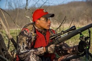 A first deer rifle should be selected only after careful consideration that includes a young hunter's size.