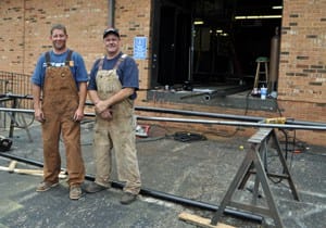 Nathan May (left) and Glen Sloan (right) construct a 36’ gate for the shooting complex.
