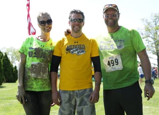 Brotherhood Outdoors co-hosts Julie McQueen and Daniel Lee Martin with Ryan Anderson (center) after Mud Run