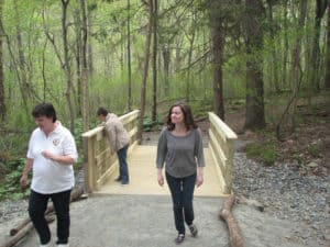 A new walking bridge is enjoyed by visiting patrons at the Ned Smith Center for Nature & Art thanks to the USA's 'Work Boots on the Ground' conservation program.