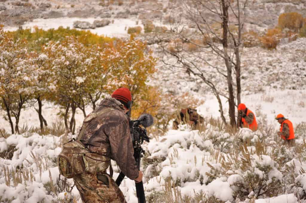 Cameraman Filming Elk Hunt in Snow