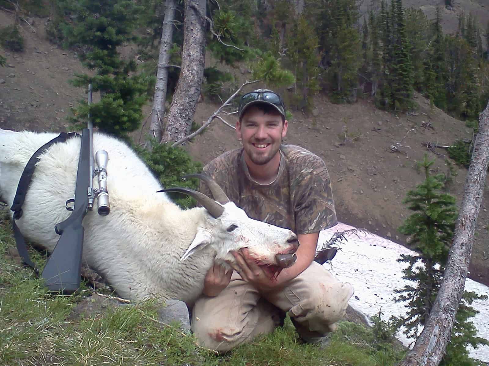 image: hunter with mountain goat