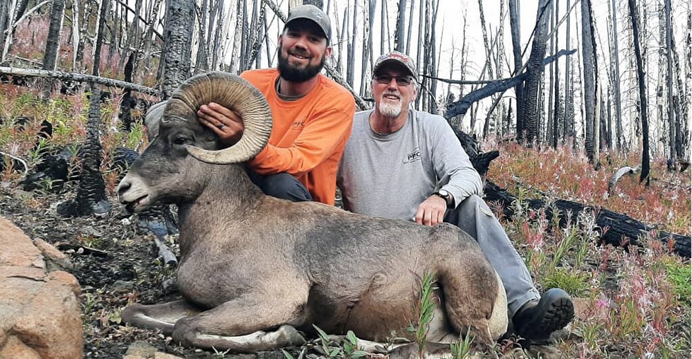 image: hunter and dad with bighorn sheep