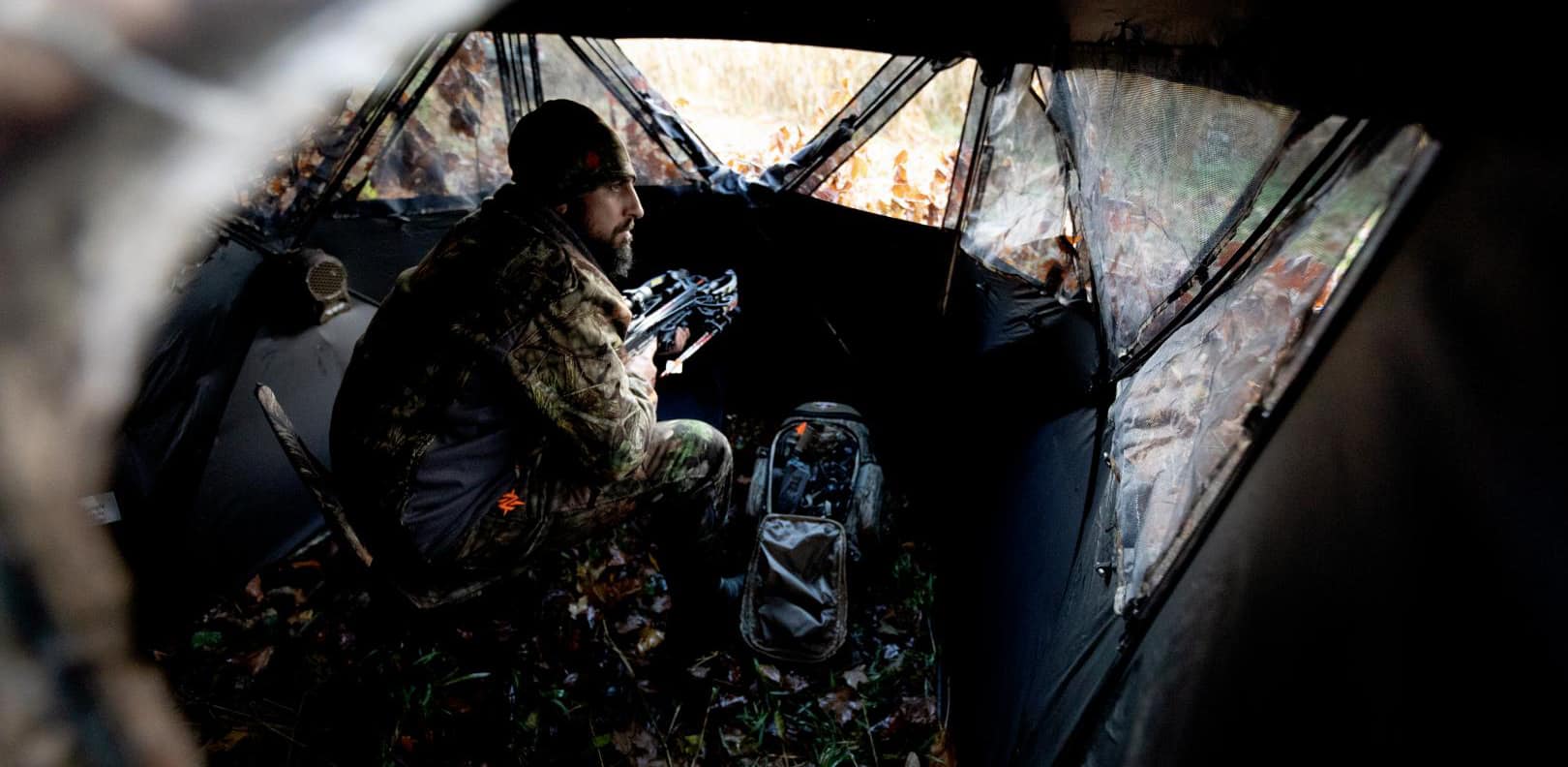 image: hunter waits for turkey in blind