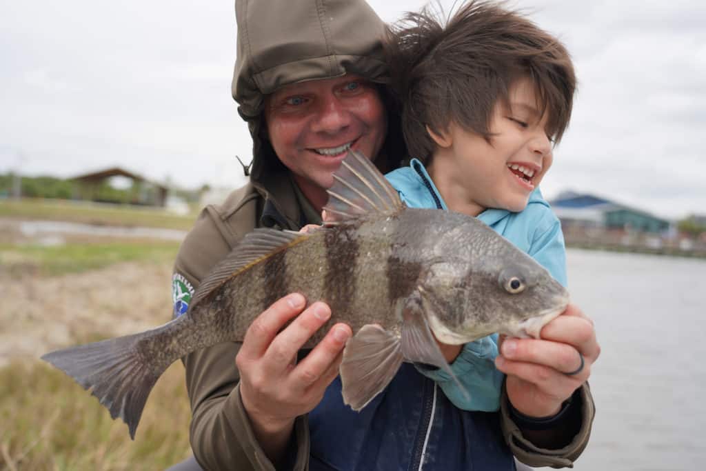image: blind child catches first fish