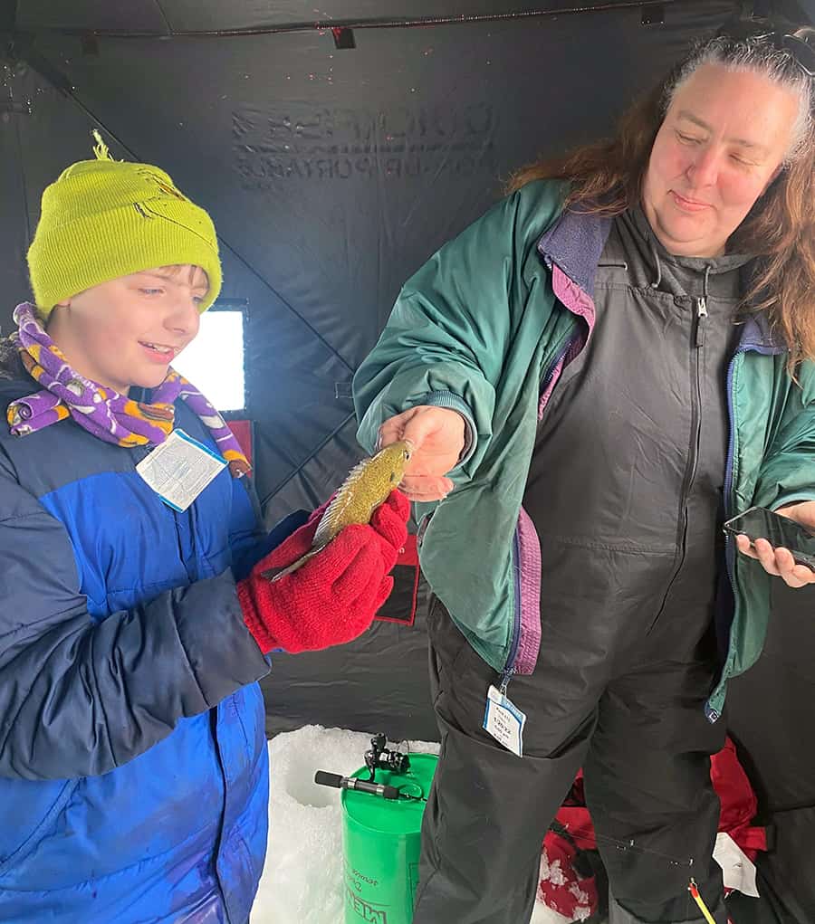 image: mother and son ice fishing