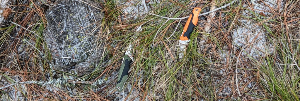 image: green and orange knife on ground