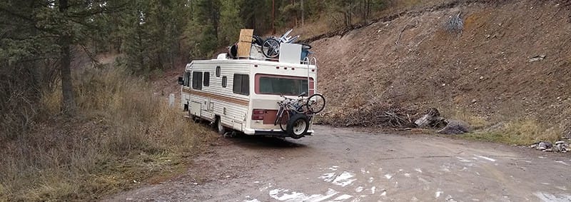 image: large RV on dirt road