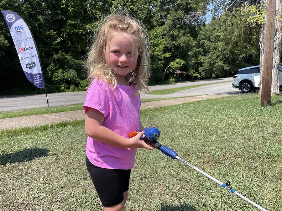 image: little girl fishing
