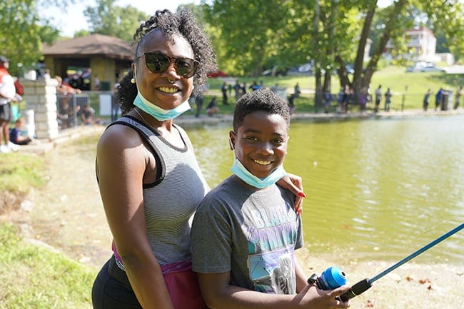image: mom and son fishing local pond