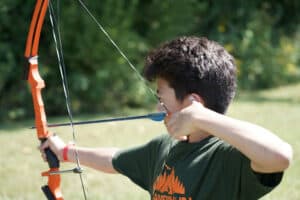 image: boy shooting bow