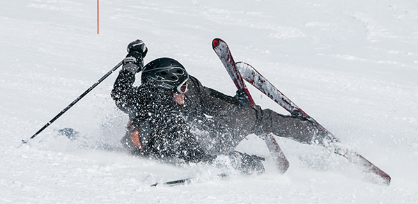 image: Skier after fall on the ski slope.