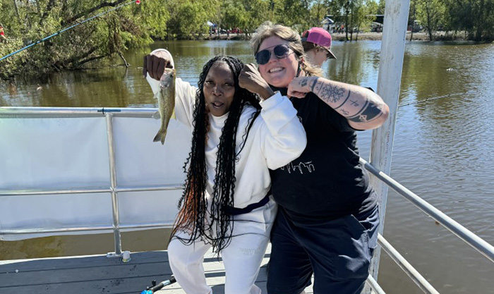 image: two women with fish