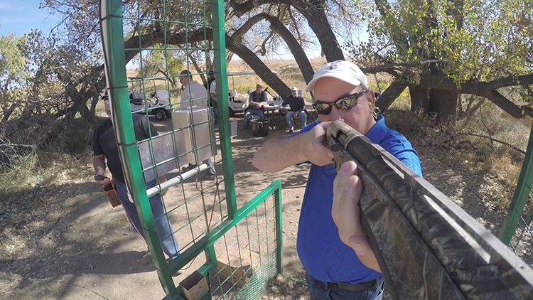 image_front view of man shooting shotgun.