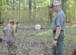 Loman Scarbrough instructs a youth archer