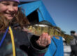 Youth angler holding up a fish