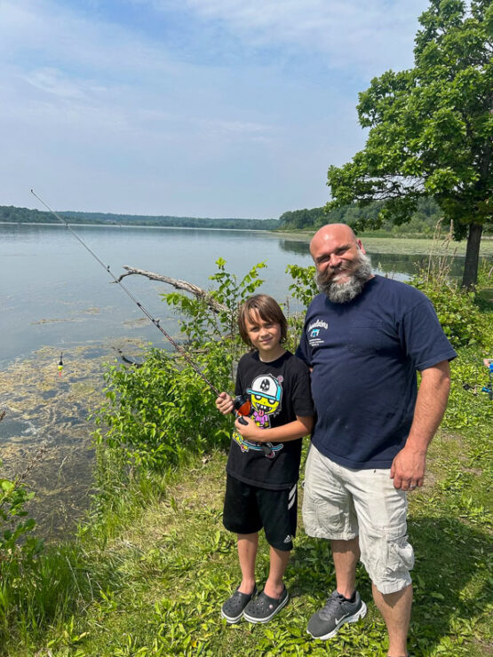 Father and son at the 2025 Madison Take Kids Fishing Day.