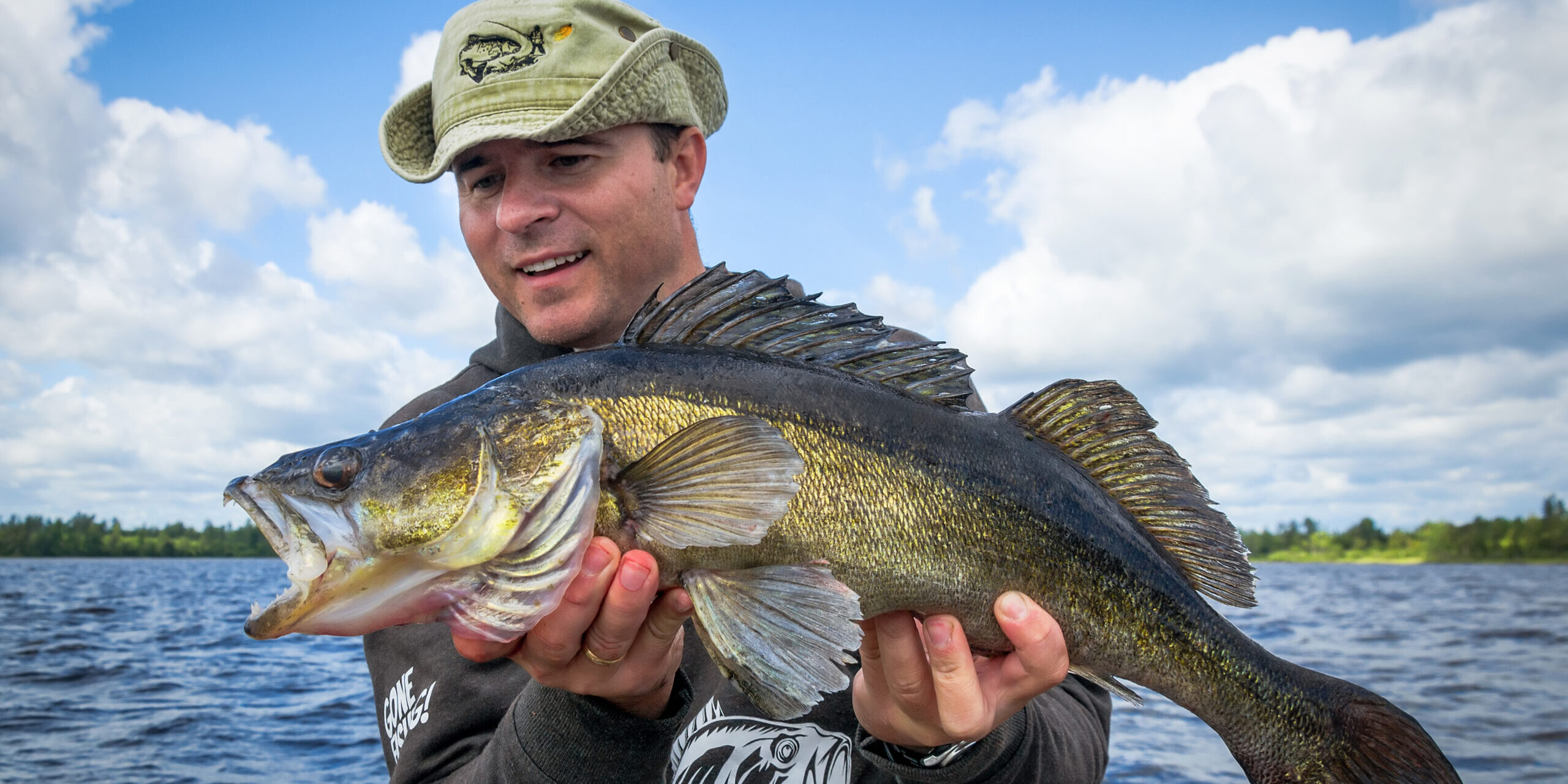 Happy,Angler,With,Old,Walleye,Fish