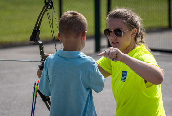 USA Conservation Coordinator Maggie Sager at archery station