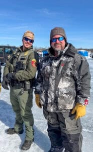 Two of the volunteers at Take Kids Ice Fishing on Feb. 21.