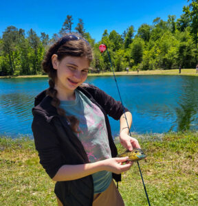 Youth catching a fish
