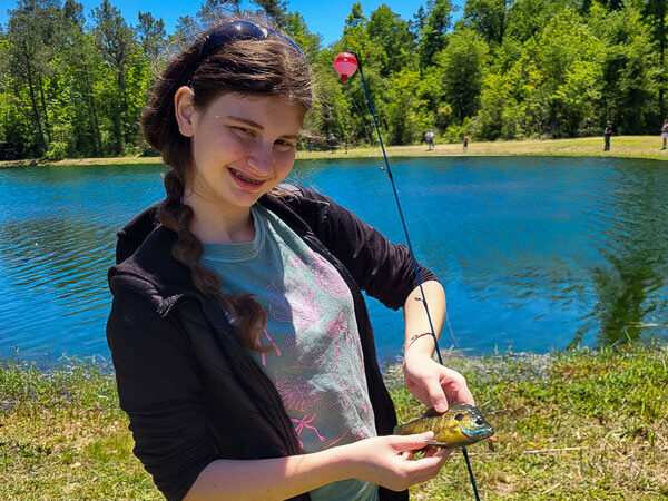 Youth catching a fish