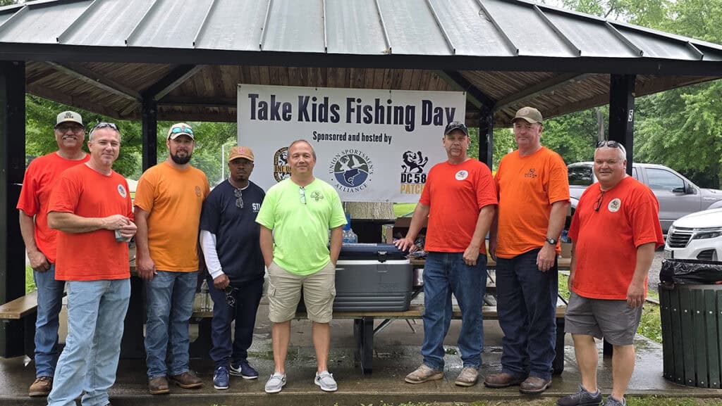 image: volunteers at fishing event