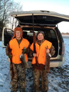 Boston (left) on a past hunting trip.