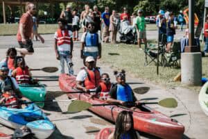 Youth participants in Kayaks at Flint Area Get Youth Outdoors Day.