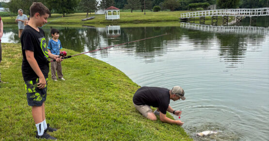 Volunteer snagging a fish