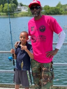 Father and son with fish