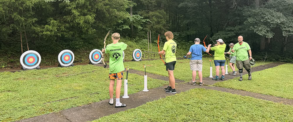 image: youth shooting archery